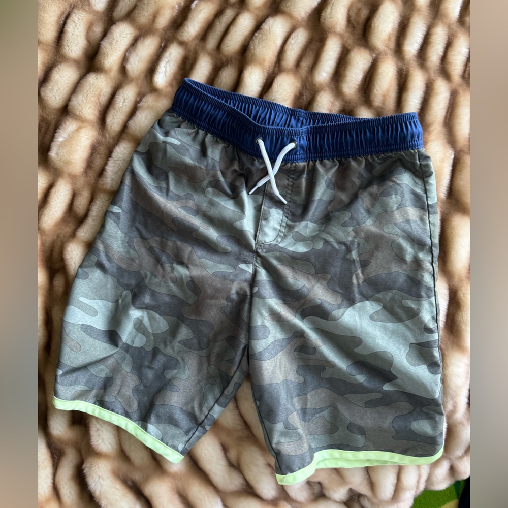 Boys Carters size 12 swim trunks in camo and blue with green trim